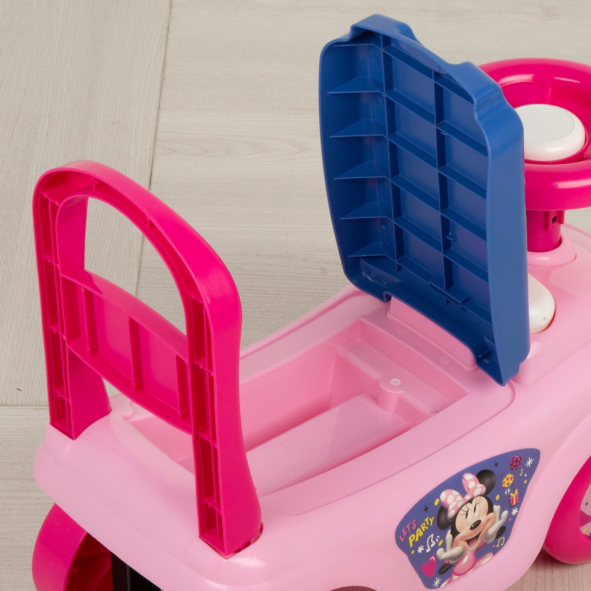 Brinquedo de encaixe da Minnie Mouse com telefone, buzina e compartimento para guardar coisas.