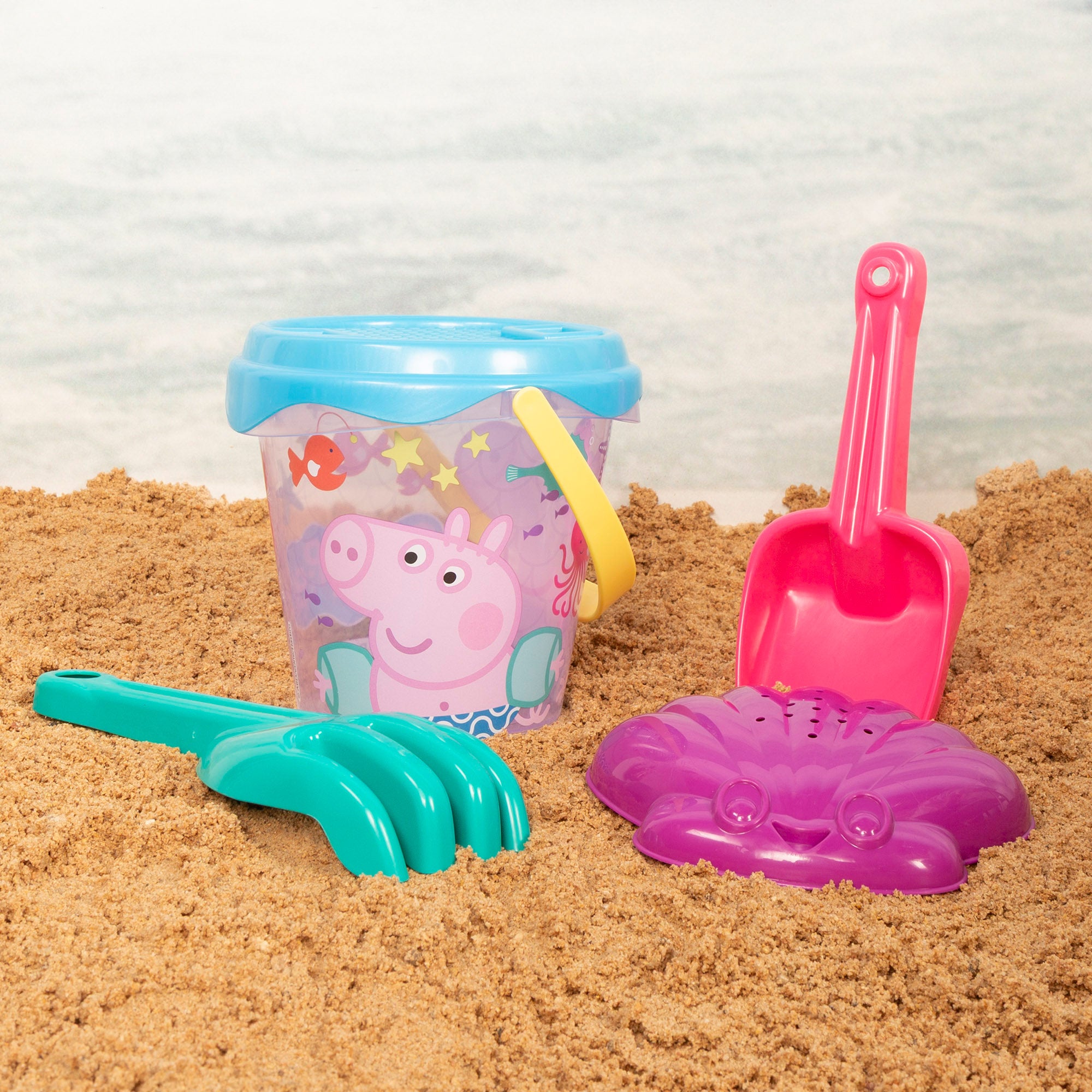 Peppa Pig Set cubo de playa con poncho, accesorios y mochila